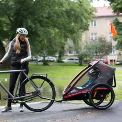 Kinderkarren < Hamax Outback One Bike Trailer for 1 Kid - Incl. Drawbar and Buggy Wheel - red / black