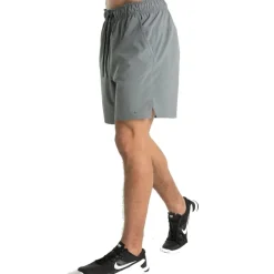 Broeken < Nike Dri-FIT Unlined Woven Korte Broek 7" Heren - oke grey/black/oke grey DV9340-084